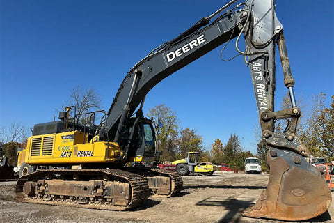 John Deere excavator with Art's Rental branding on a construction site.