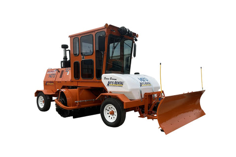 Street sweeper with a large scraper blade.