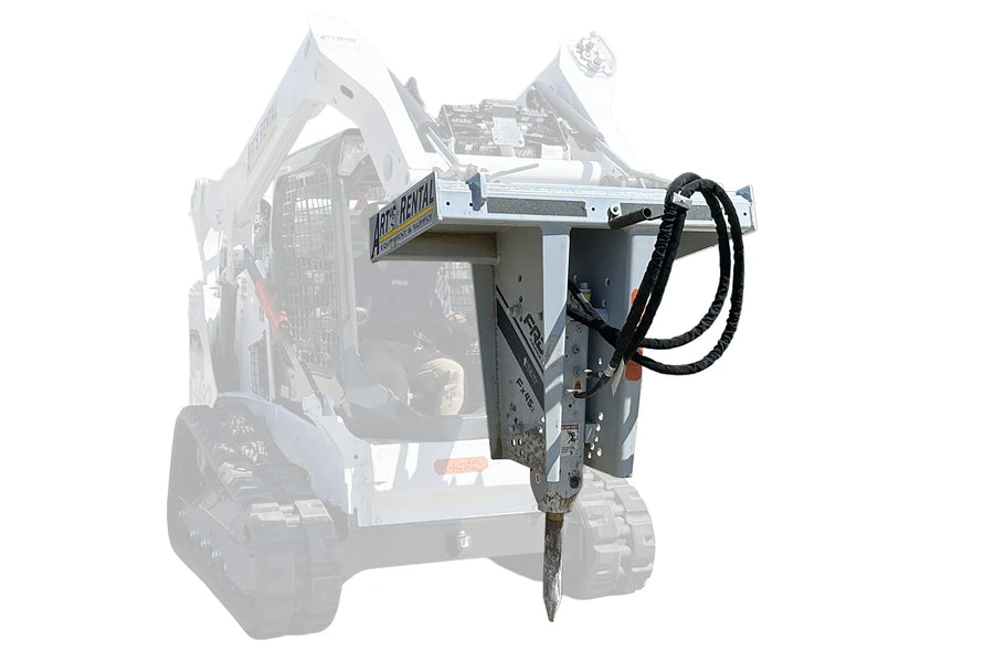 A hydraulic hammer attachment mounted to the front of a skid steer