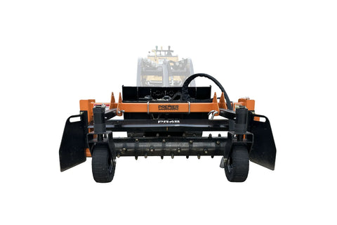 Orange and black harley rake attachment for utility loader